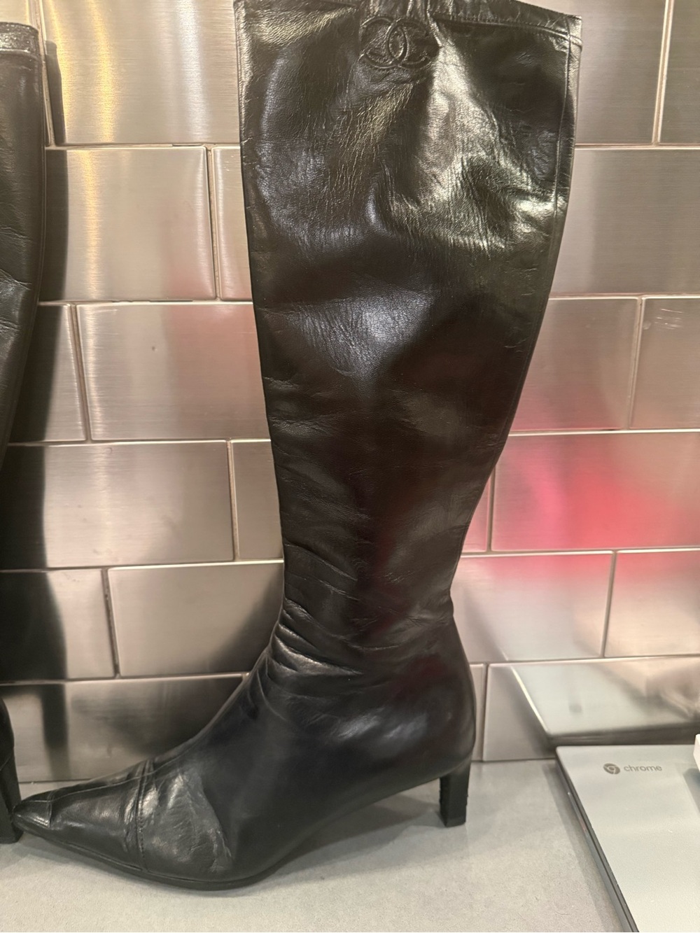 CHANEL Black Leather Over-the-Knee Pointed Boots with Subtle Logo